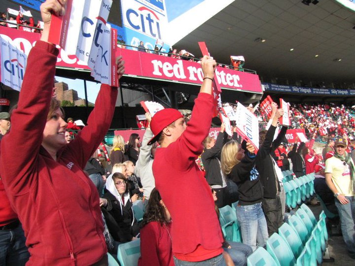 Cheering on the Swans at an Australian Football Game